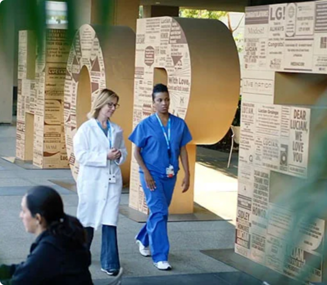 Doctor and resident walking down a hall