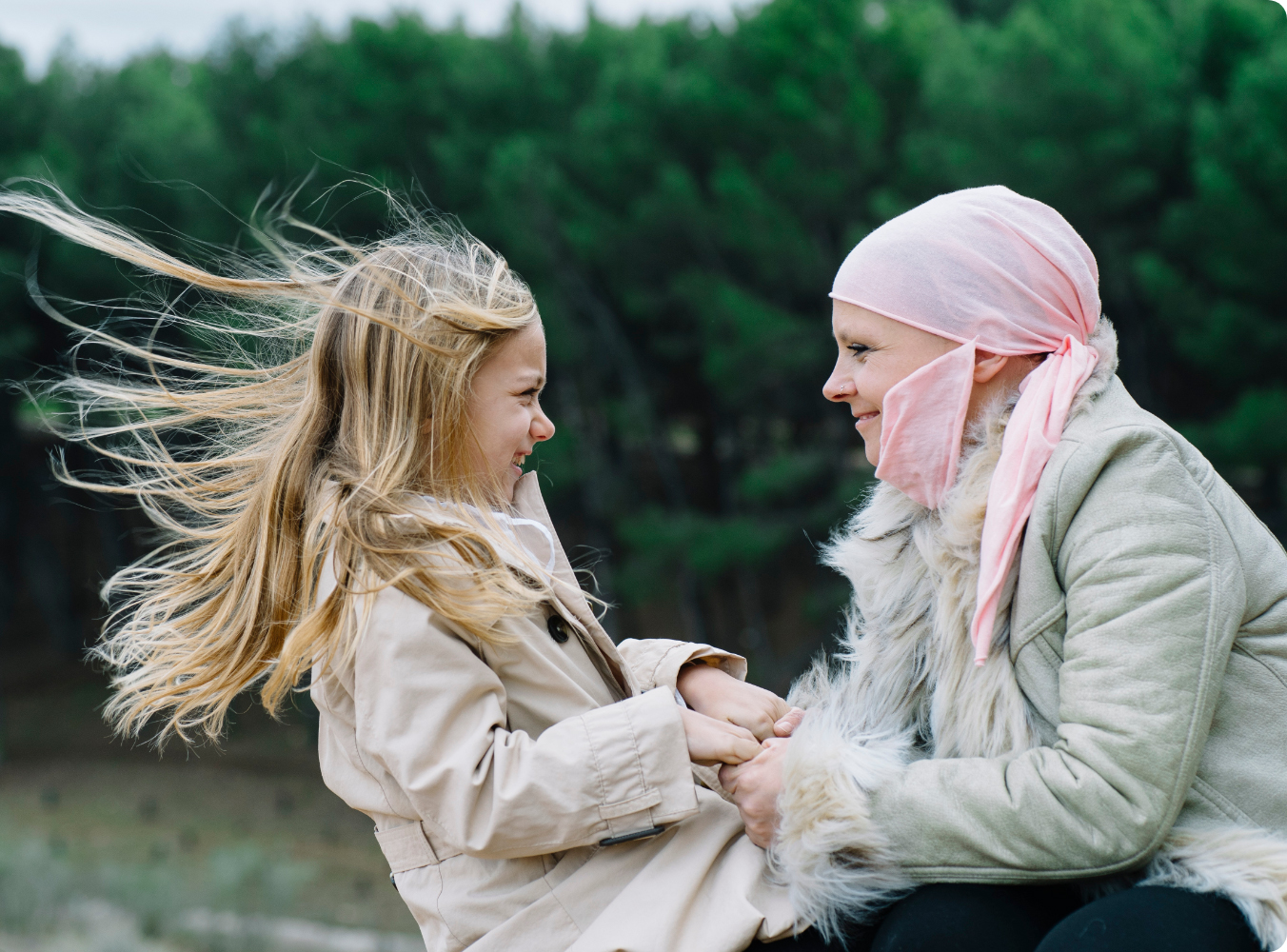 woman and her daughter playing outside