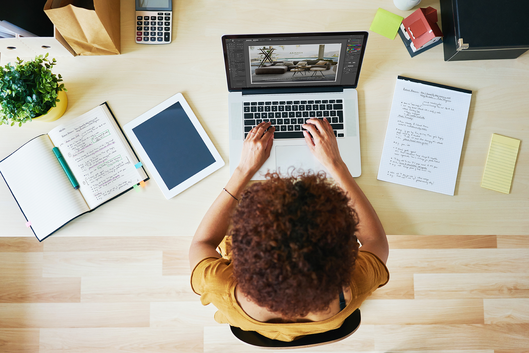 woman working on her laptop on creative services