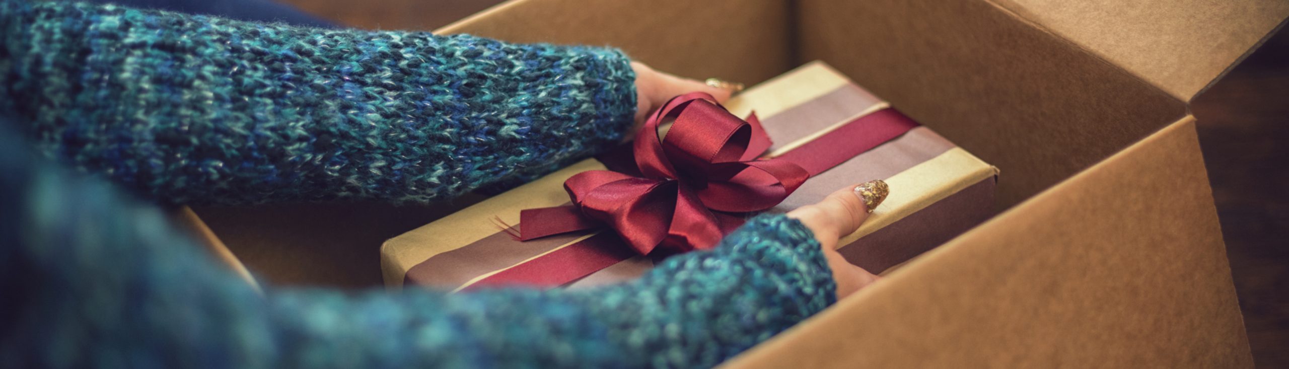 woman wrapping a present