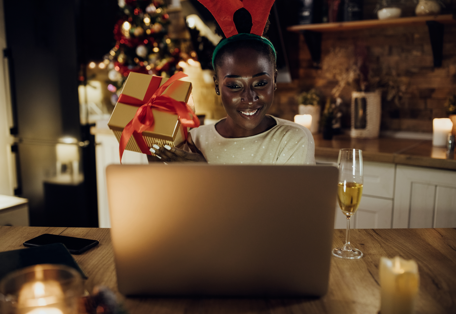 happy woman showing off her gift on a video call