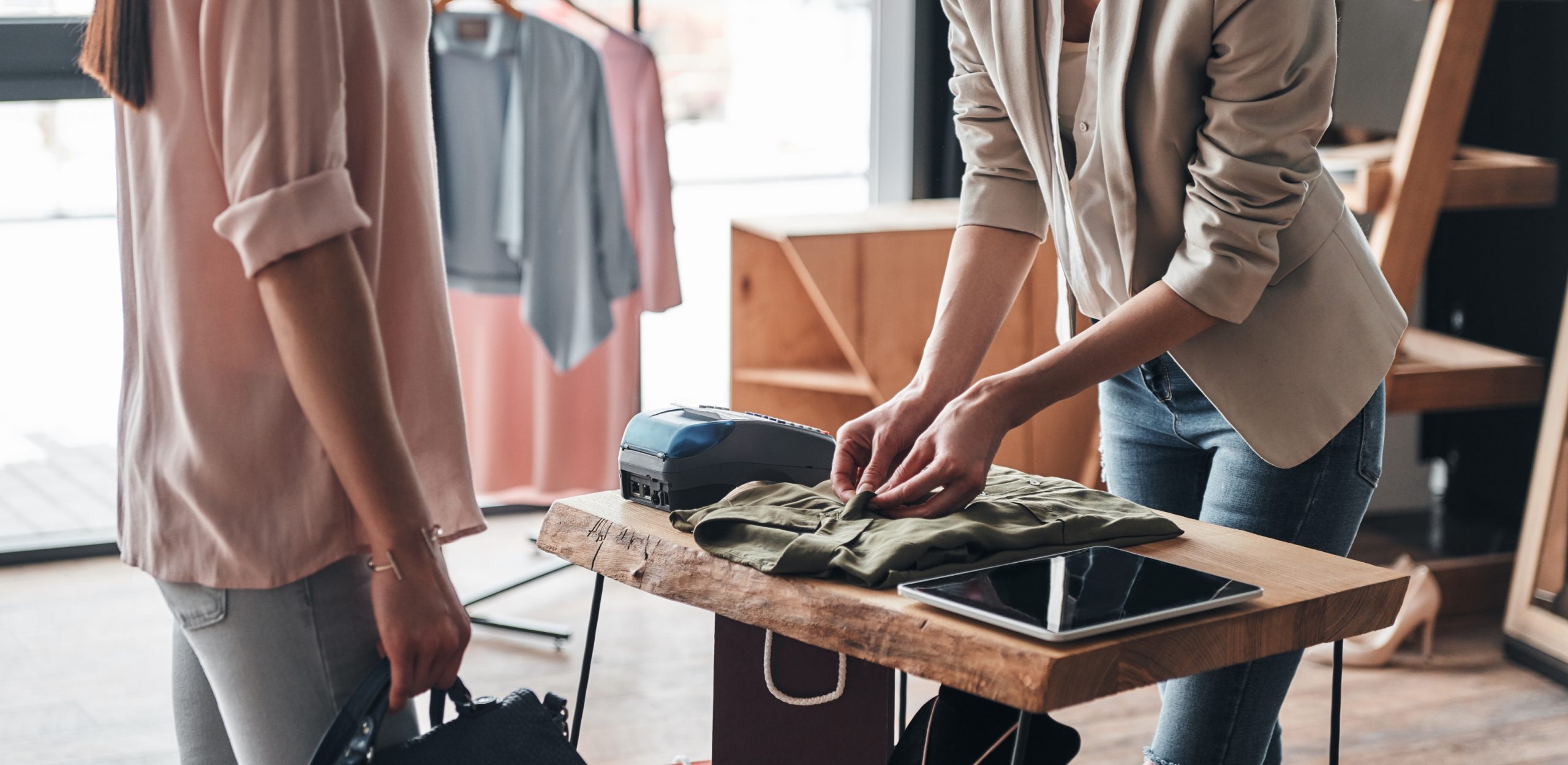 customer completing a card transaction at an apparel store