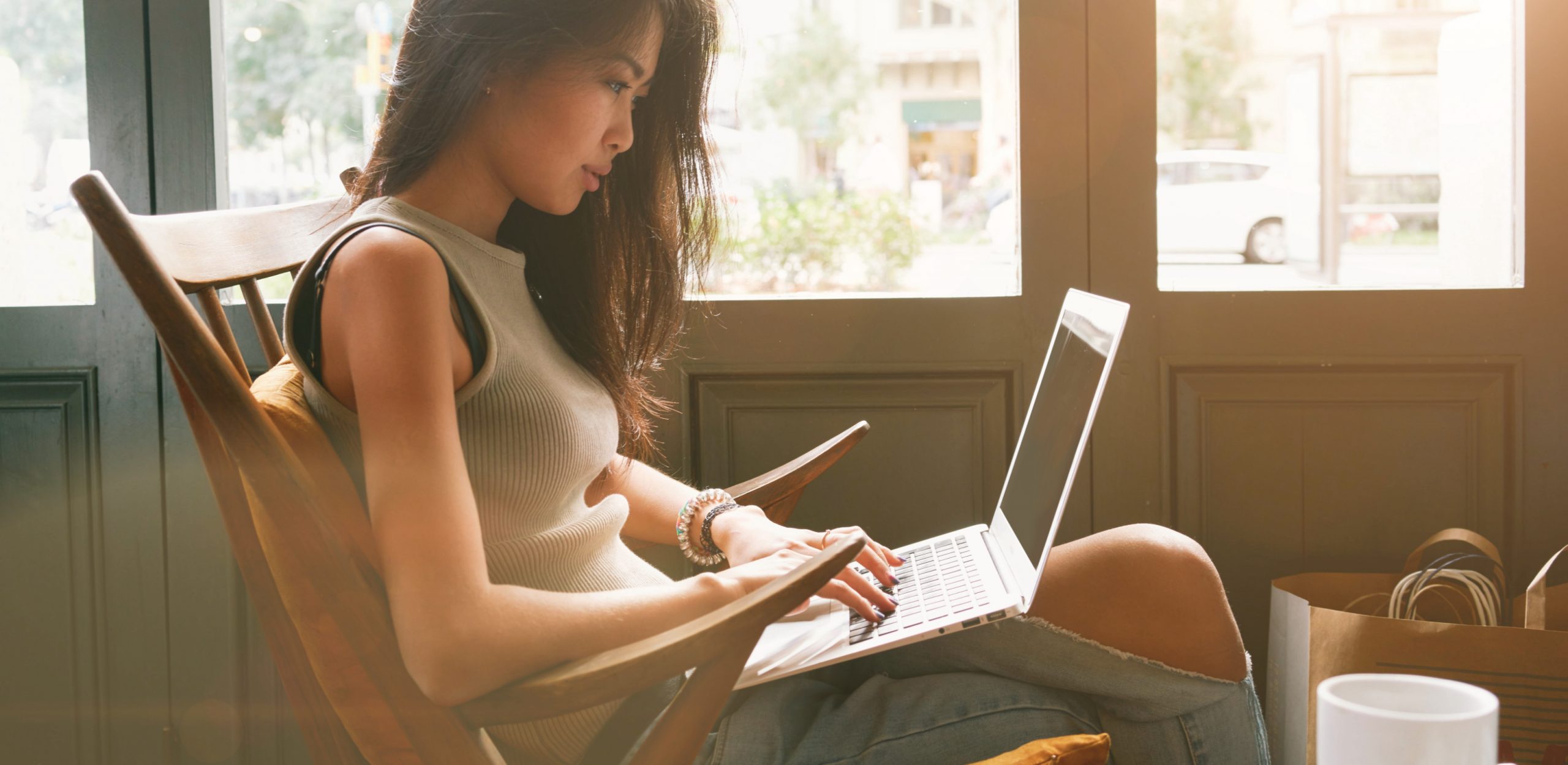 woman working in her living room on her laptop