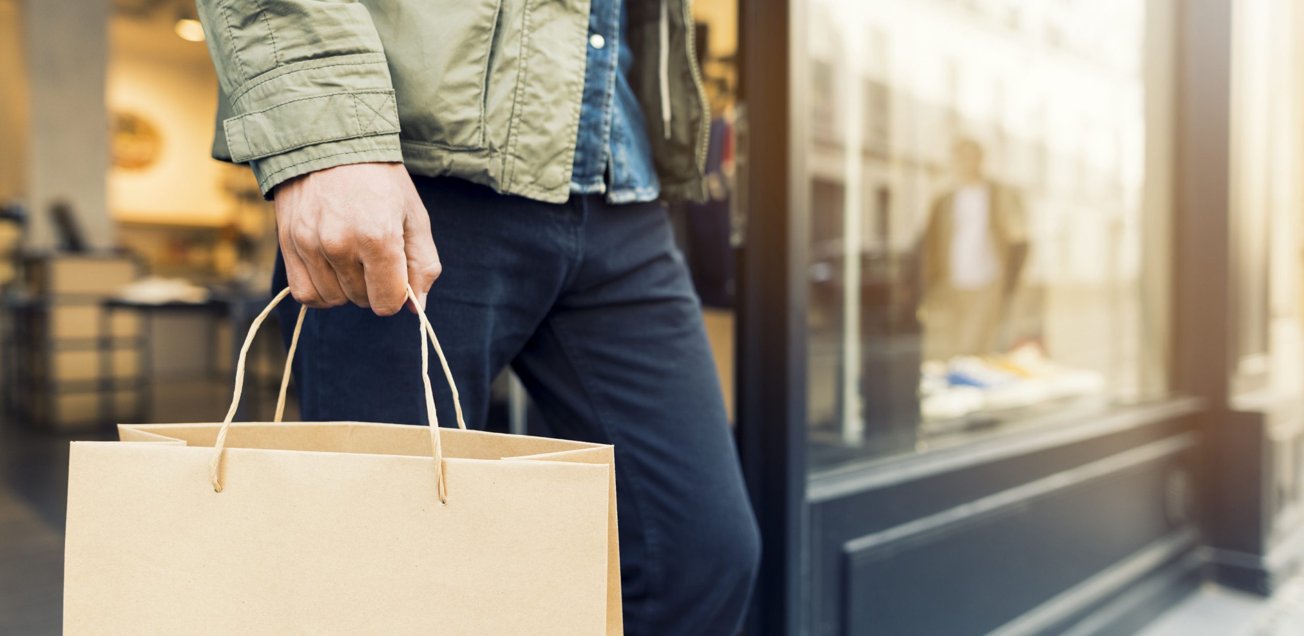 man who just finished shopping at a store