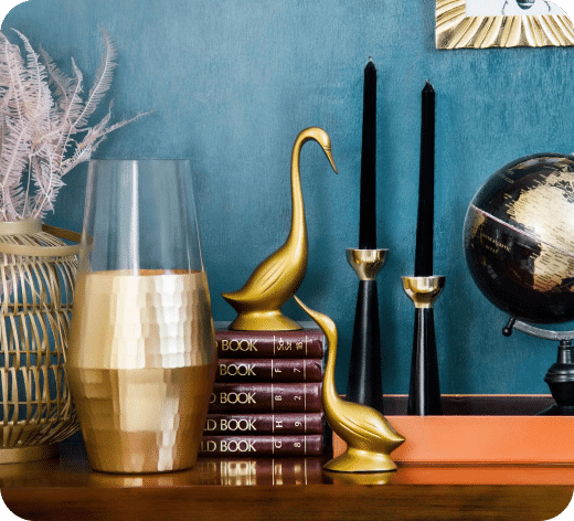 home decor such as lamps and a globe on a display table