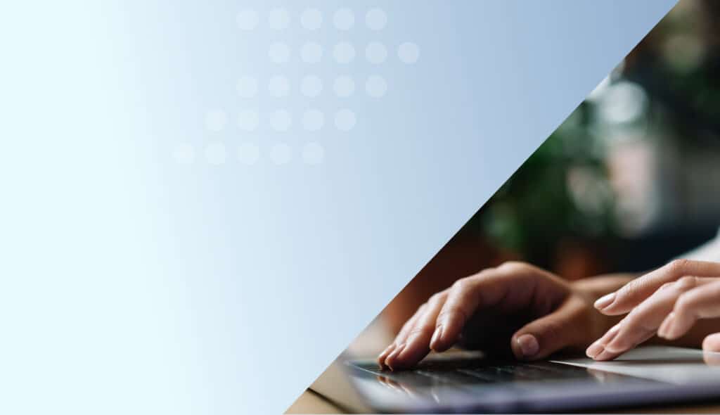 Person typing a blog on a laptop